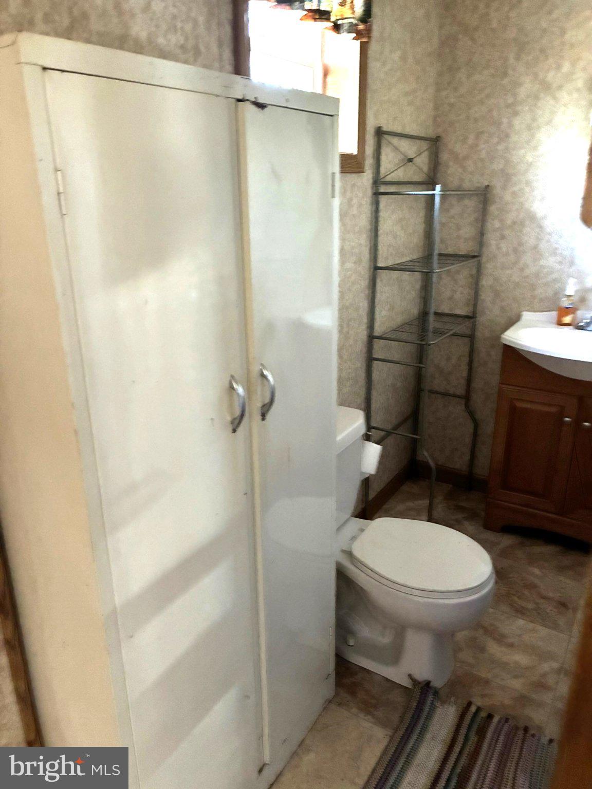 807 Sand Spring Road Beech Creek, PA 16822 - Photo 16 of 30 Cozy bathroom with essential amenities.