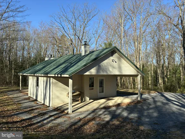a house with trees in front of it