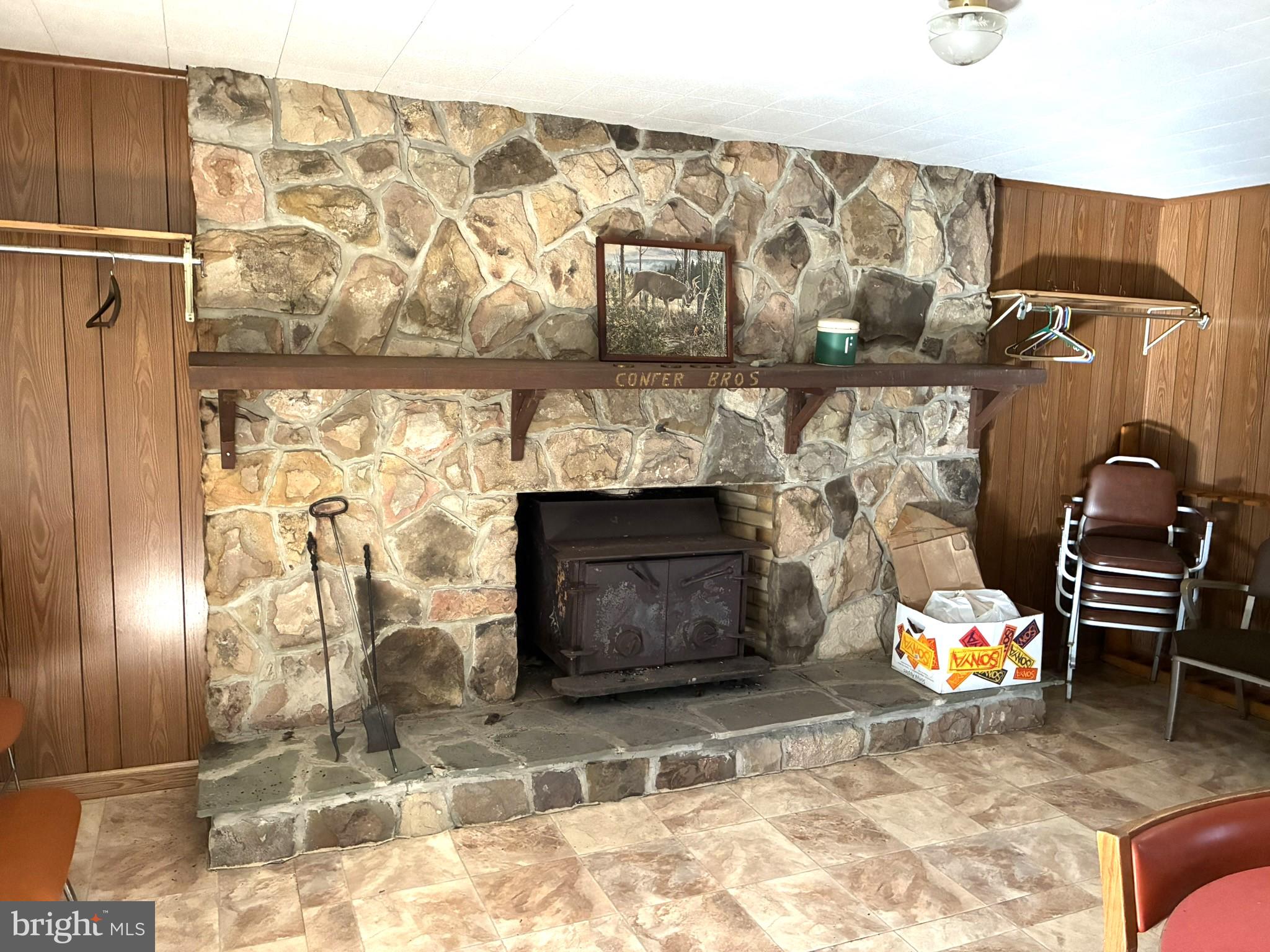 807 Sand Spring Road Beech Creek, PA 16822 - Photo 3 of 30 Rustic stone fireplace centerpiece.