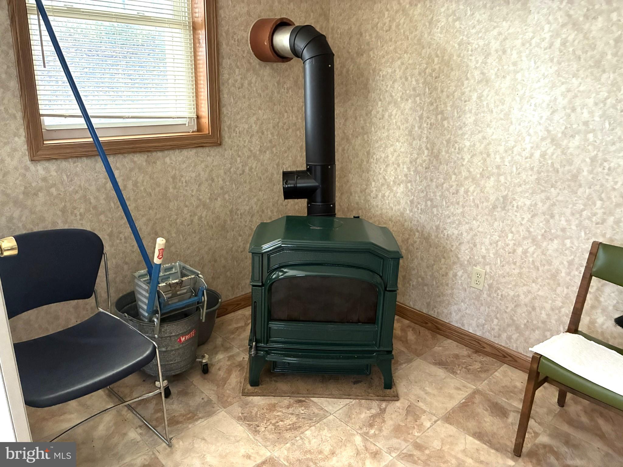 807 Sand Spring Road Beech Creek, PA 16822 - Photo 6 of 30 Cozy corner with a vintage stove.