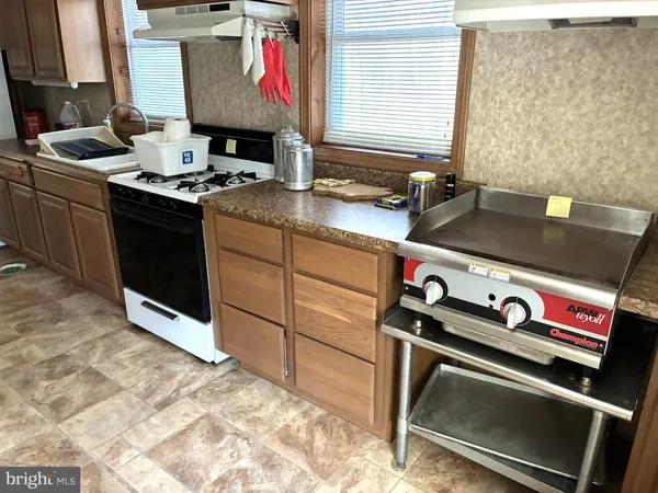 a kitchen with a stove and a sink
