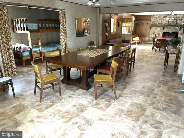 a view of a livingroom with furniture and a table