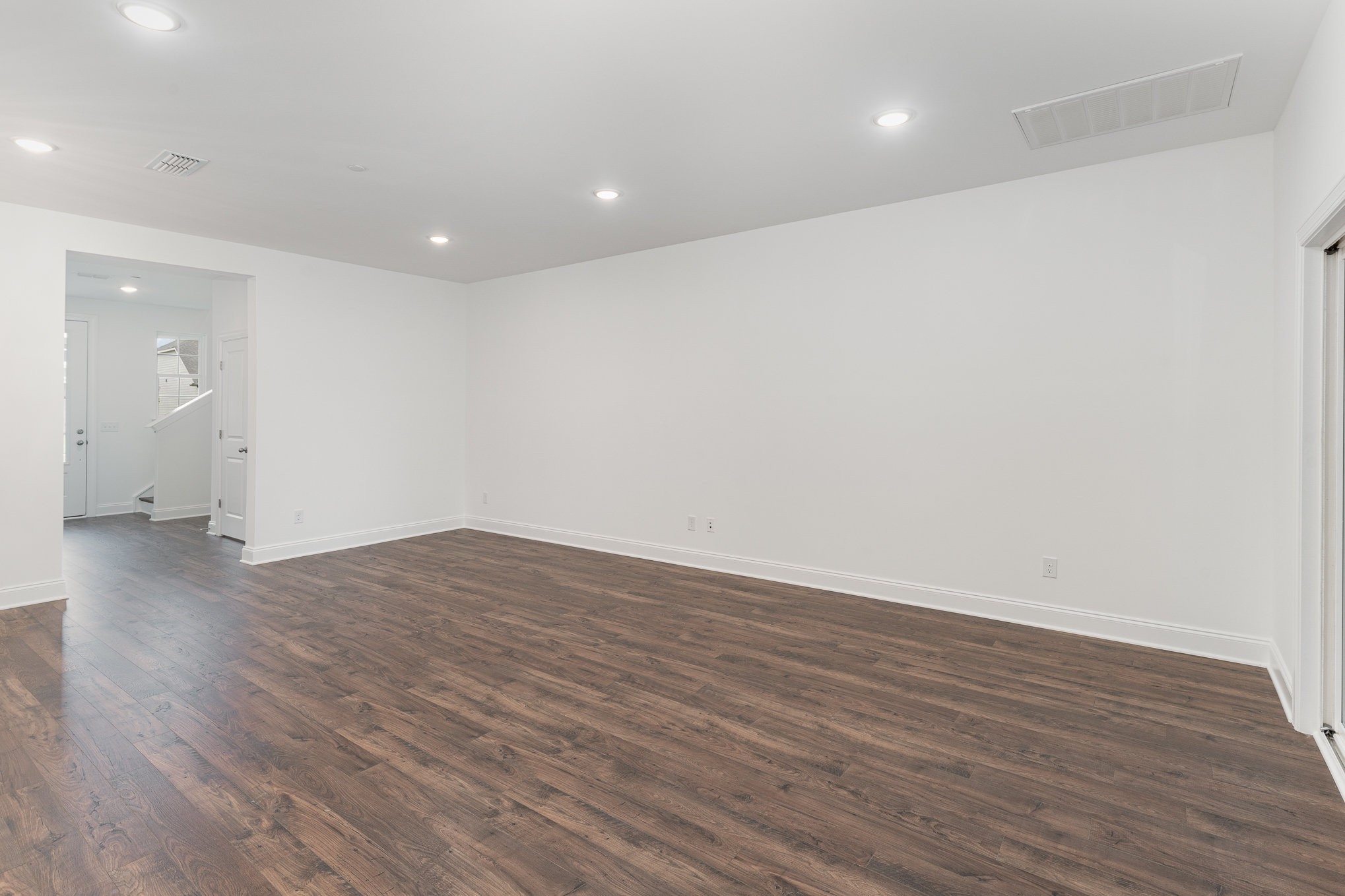 3116 Arbor Valley Rd Spring Hill Spring Hill, TN 37174 - Photo 8 of 43 an empty room with wooden floor and entrance