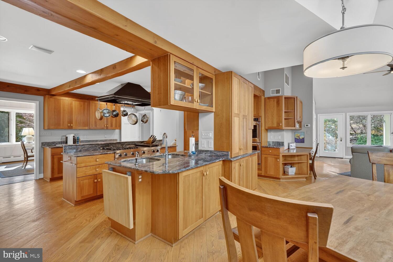 3201 Tennyson Street Northwest Washington, DC 20015 - Photo 12 of 52 a kitchen with stainless steel appliances granite countertop a stove and a refrigerator