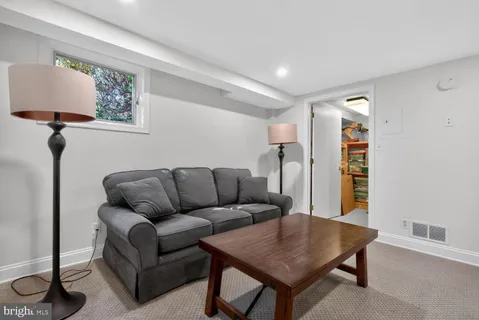 a bedroom with a bed and a desk
