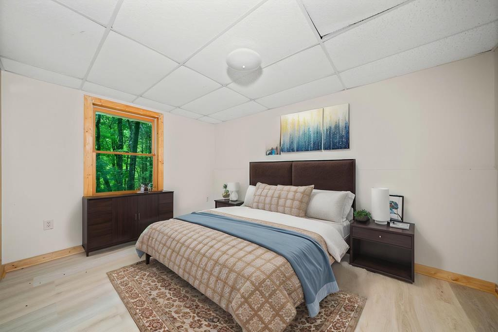 125 Waters Road Ellijay, GA 30536 - Photo 33 of 68 a bedroom with a bed and a window