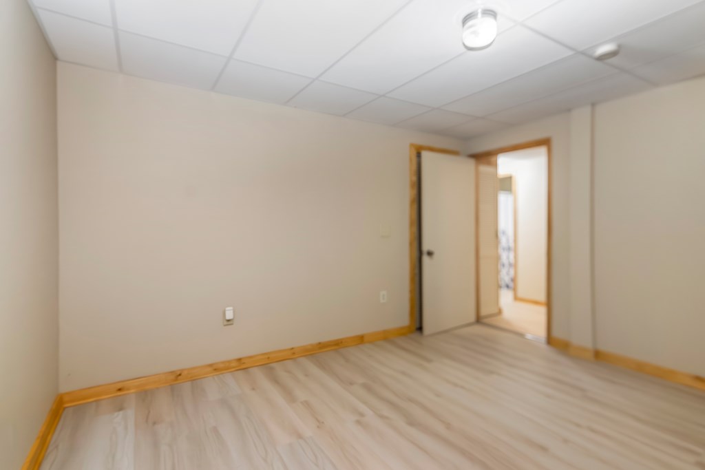 125 Waters Road Ellijay, GA 30536 - Photo 38 of 68 a view of an empty room with wooden floor