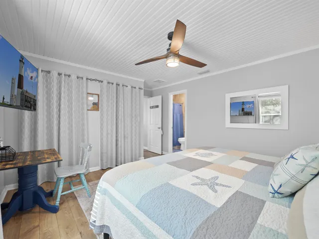 a bed room with a bed and a chandelier