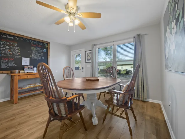 a view of a dining room with furniture and window
