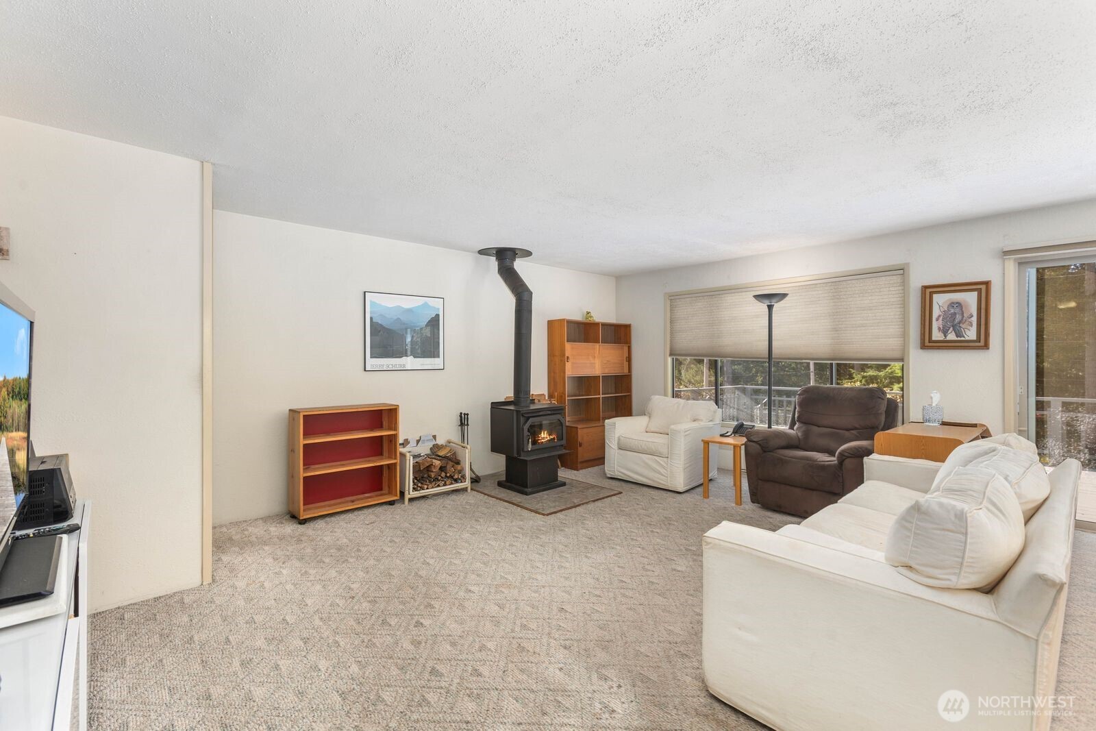 350 East Olympic Drive Grapeview, WA 98546 - Photo 16 of 40 a living room with furniture a couch and dresser