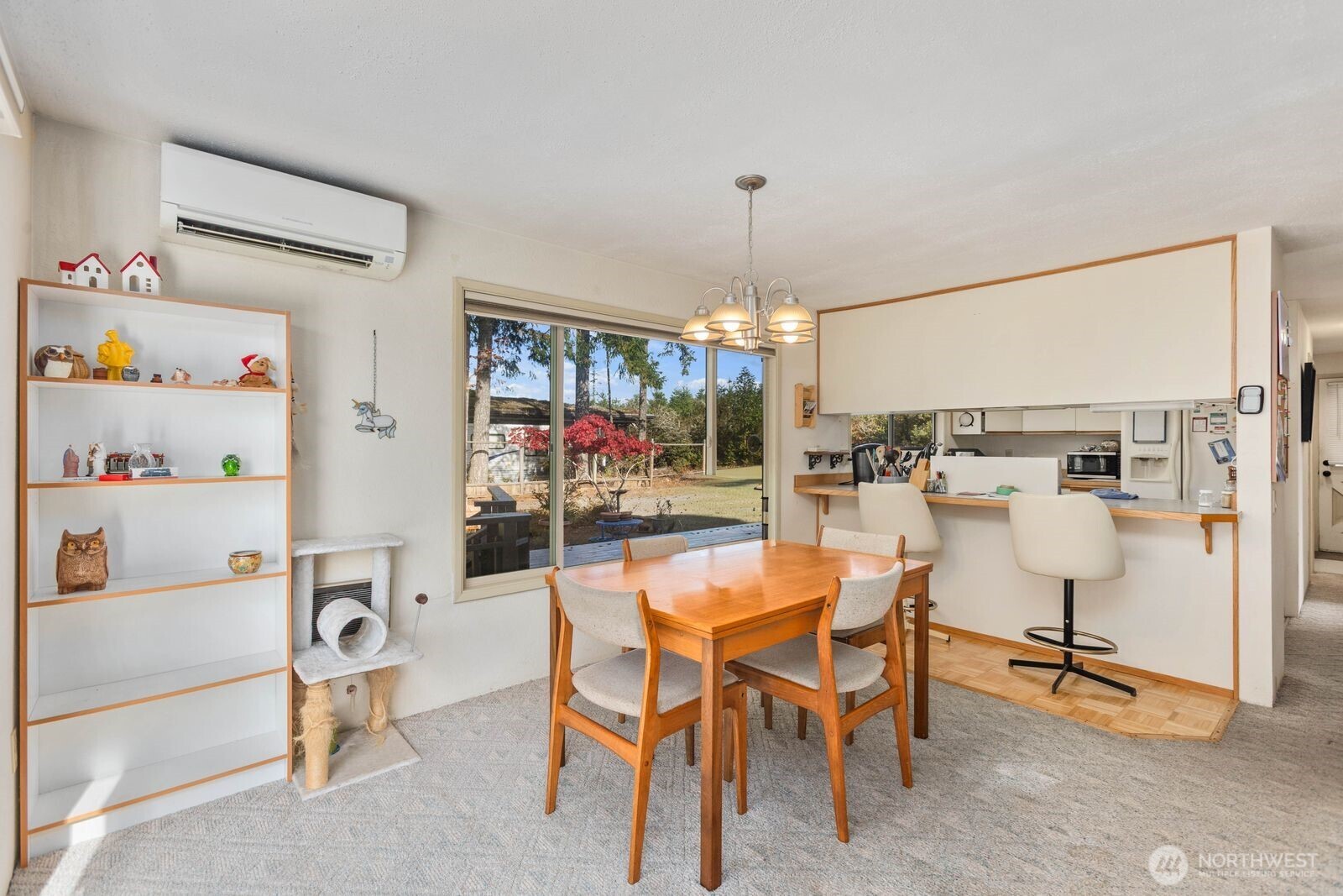 350 East Olympic Drive Grapeview, WA 98546 - Photo 18 of 40 a view of a dining room with furniture and chandelier
