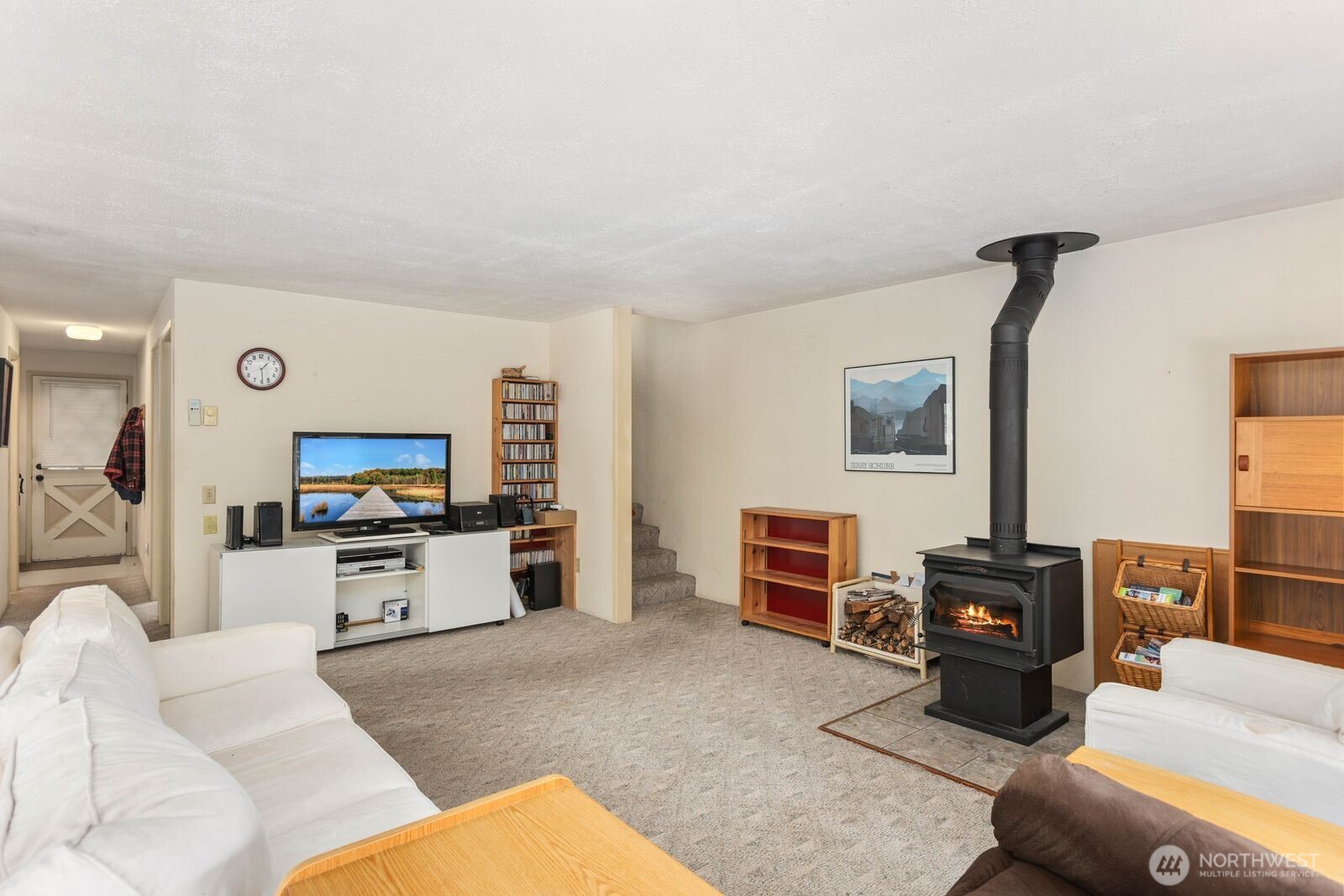 350 East Olympic Drive Grapeview, WA 98546 - Photo 20 of 40 a living room with furniture and a flat screen tv