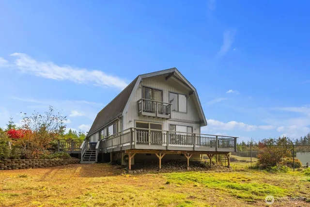 a view of a large body of water with a building in the background