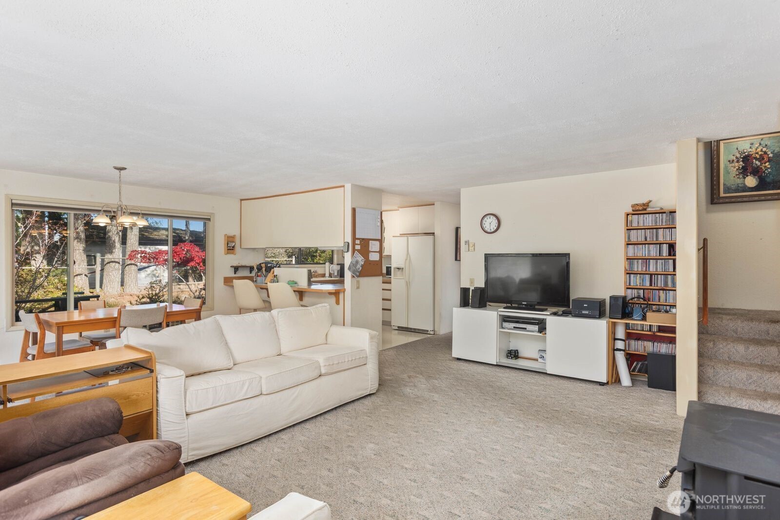 350 East Olympic Drive Grapeview, WA 98546 - Photo 21 of 40 a living room with furniture and a flat screen tv