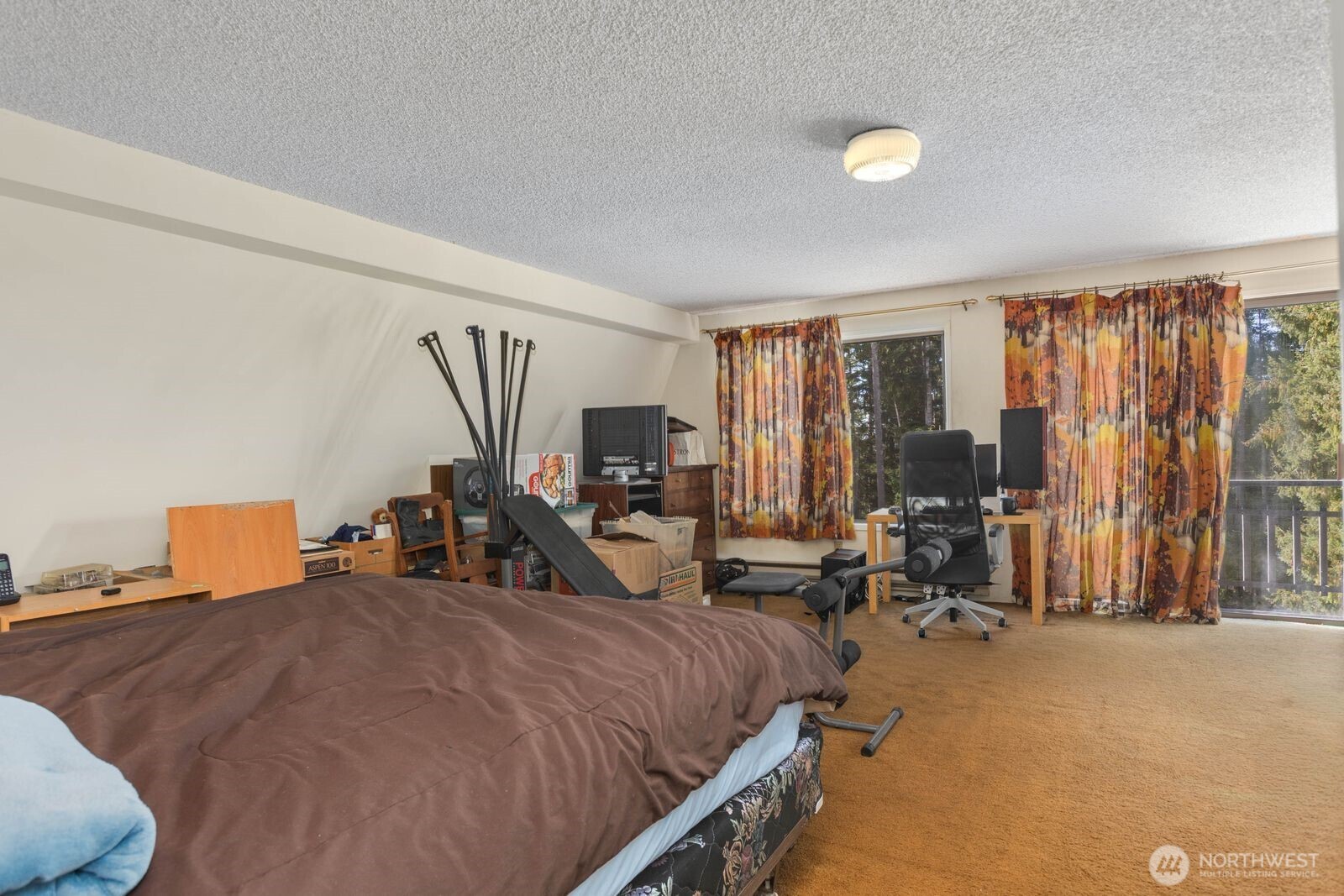 350 East Olympic Drive Grapeview, WA 98546 - Photo 24 of 40 a bed room with two bed and a large window