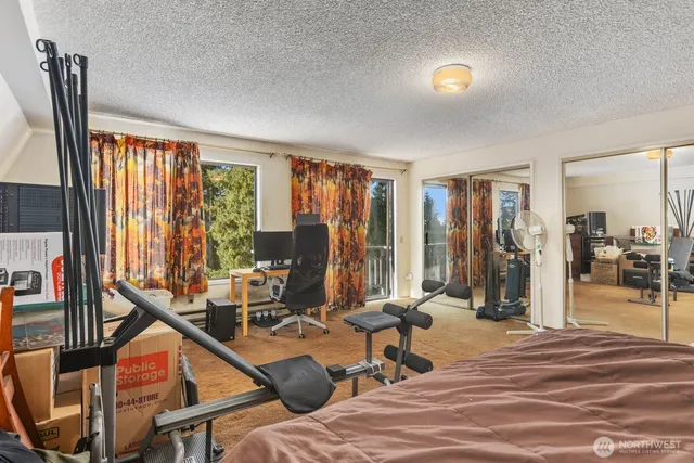 a view of a livingroom with furniture and a window