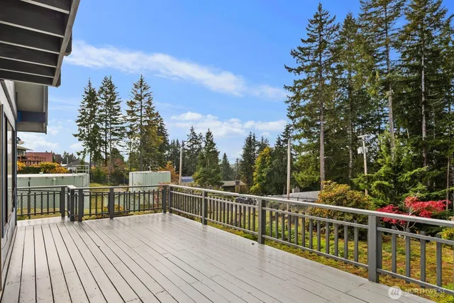 a view of a balcony with wooden floor