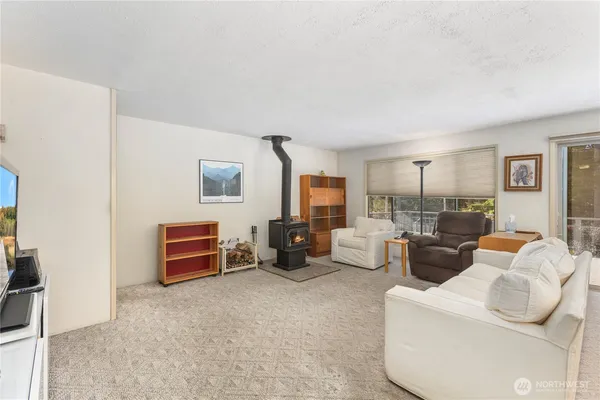 a living room with furniture a couch and dresser