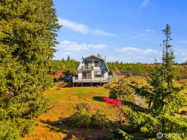 a picture of a houses with a yard