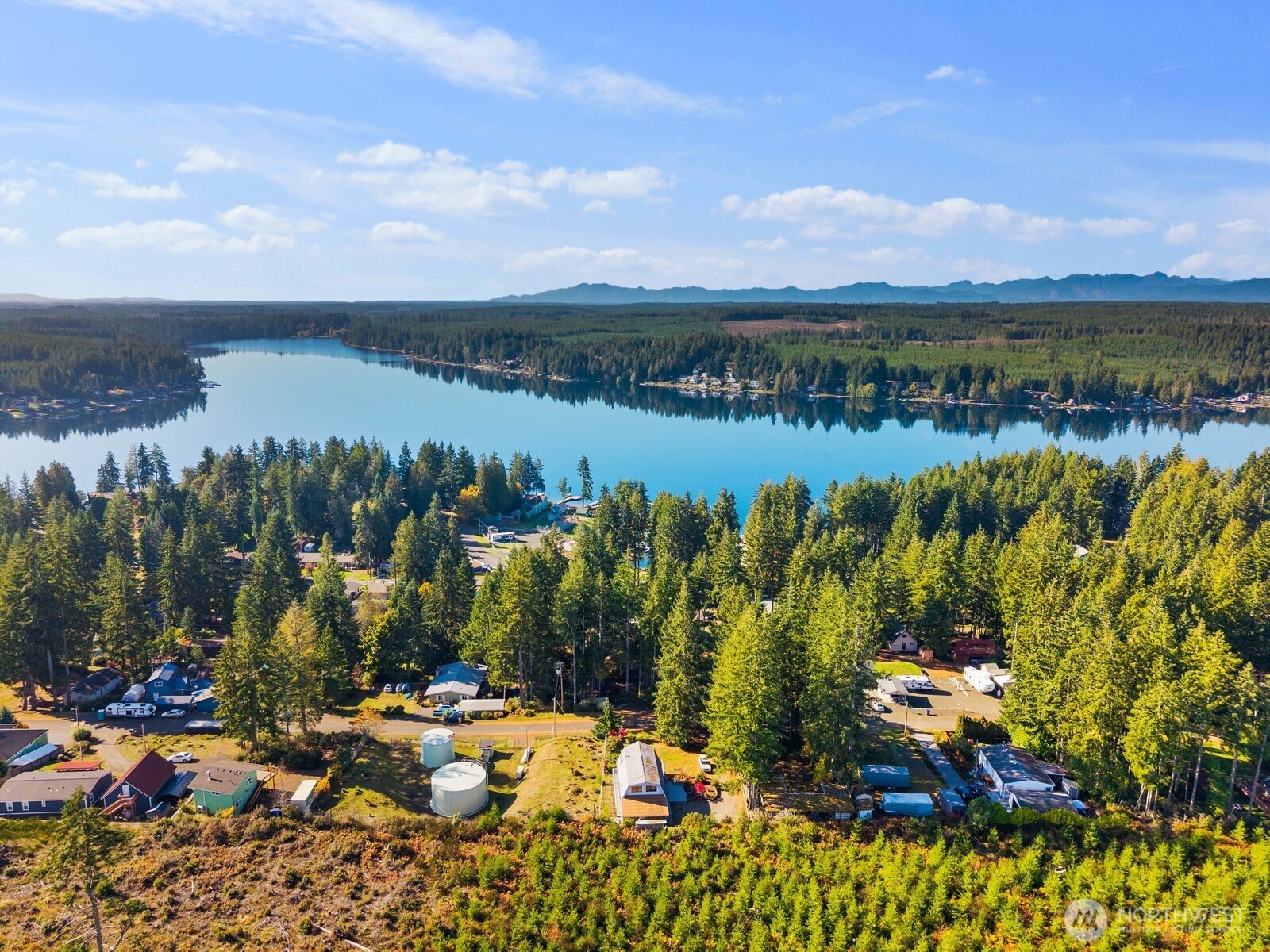 350 East Olympic Drive Grapeview, WA 98546 - Photo 37 of 40 a view of a lake with a mountain in the background