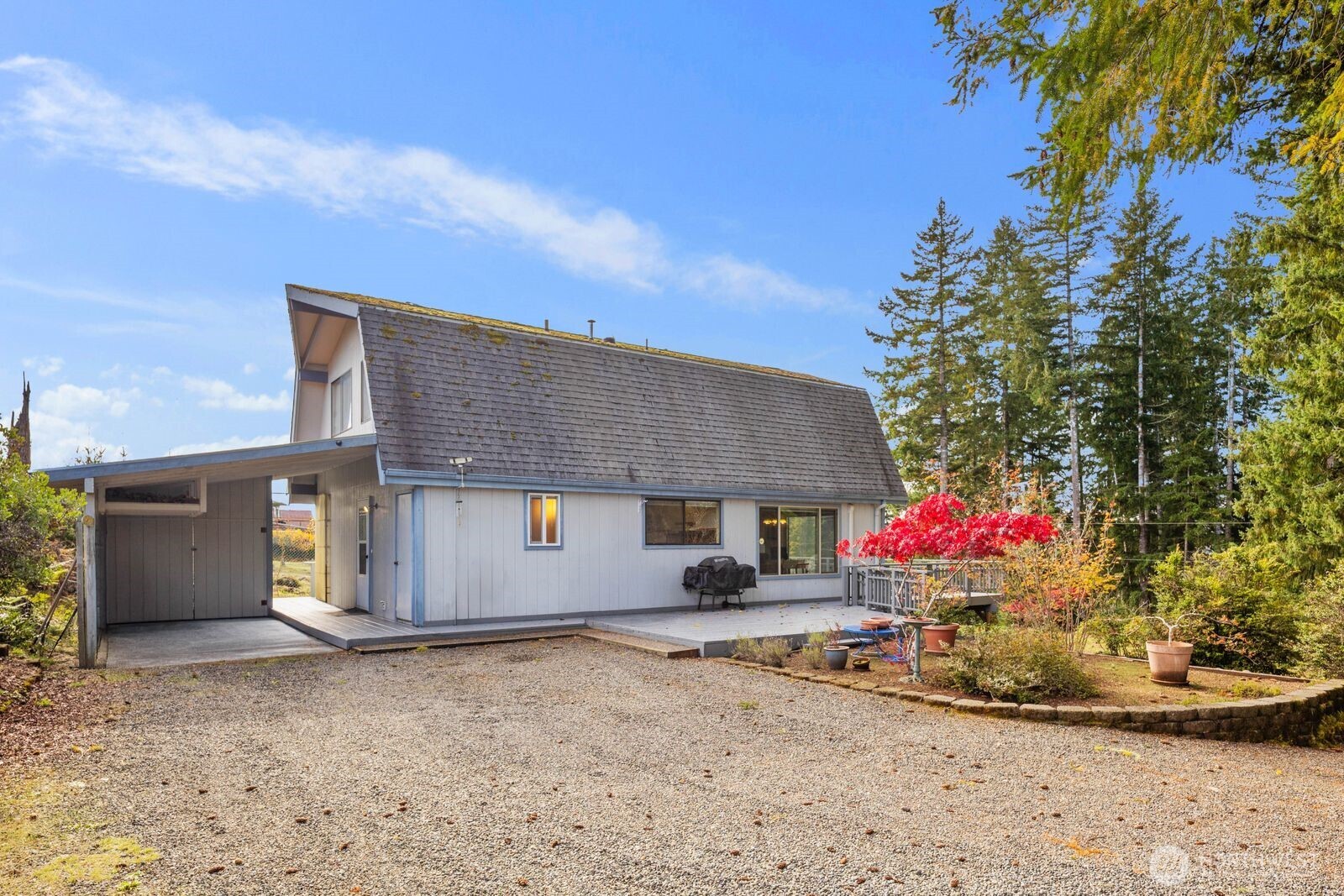 350 East Olympic Drive Grapeview, WA 98546 - Photo 5 of 40 a front view of a house with a yard