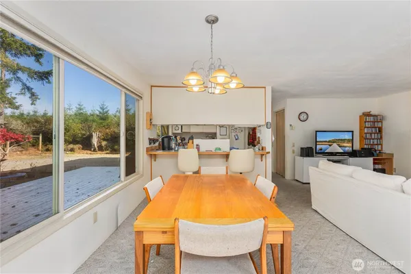 a view of a living room and dining room
