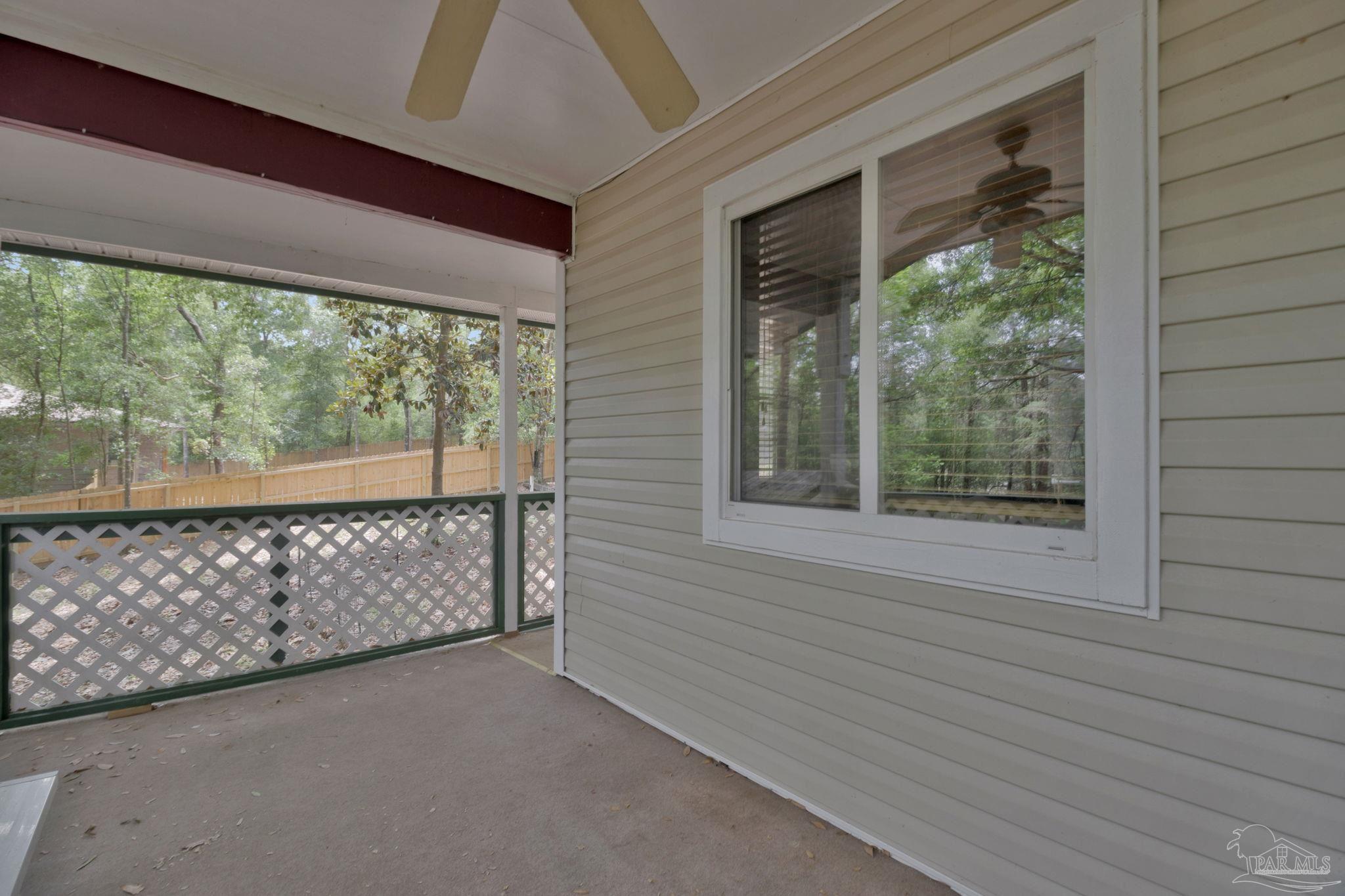 10290 West Lake Road Milton, FL 32583 - Photo 21 of 53 a view of outdoor space with sliding window