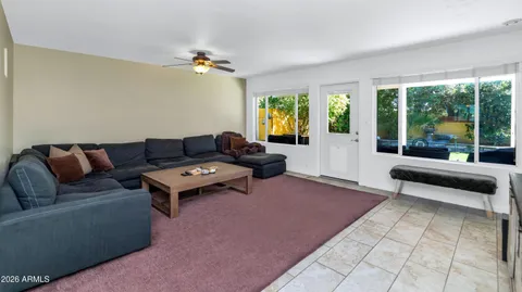 a living room with furniture and a large window