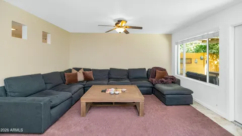 a living room with furniture and a window