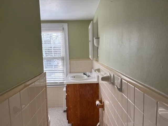a bathroom with a sink a vanity and a mirror