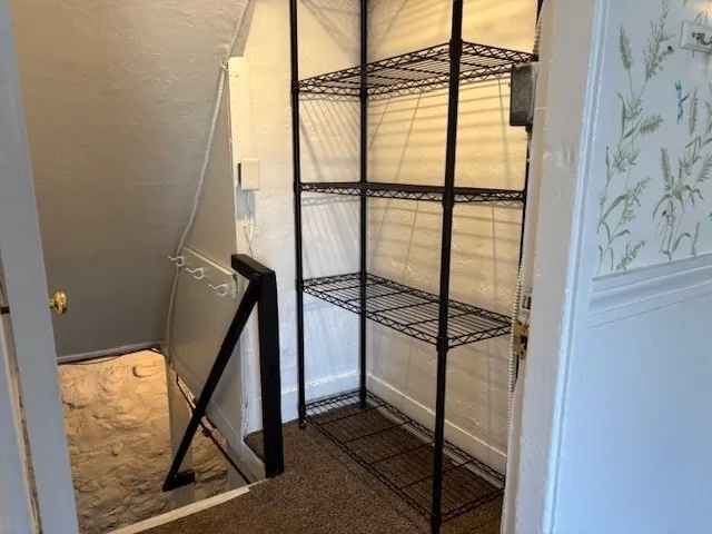 a view of room with wooden walls