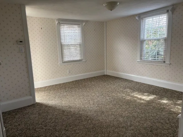 an empty room with windows