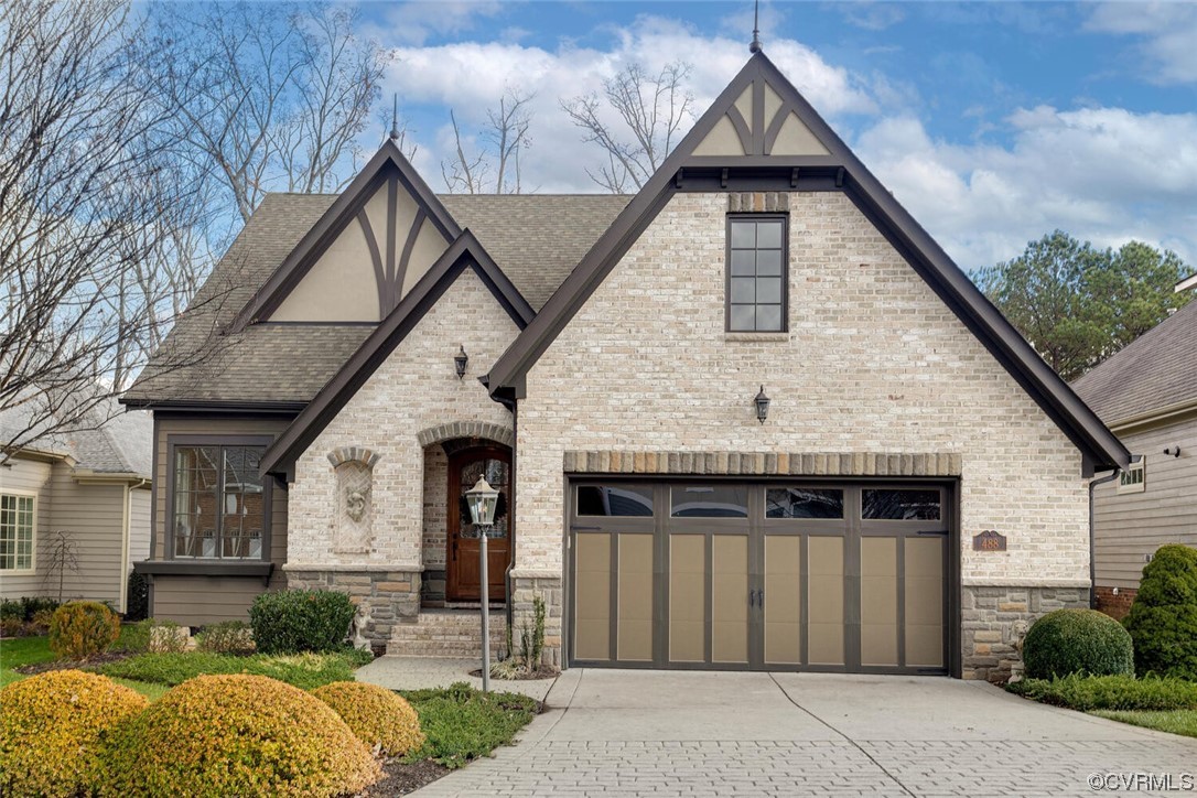a front view of a house with garage