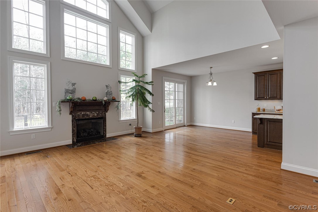 488 Bel Bridge Circle Midlothian, VA 23113 - Photo 12 of 38 a view of an empty room with a kitchen and a window