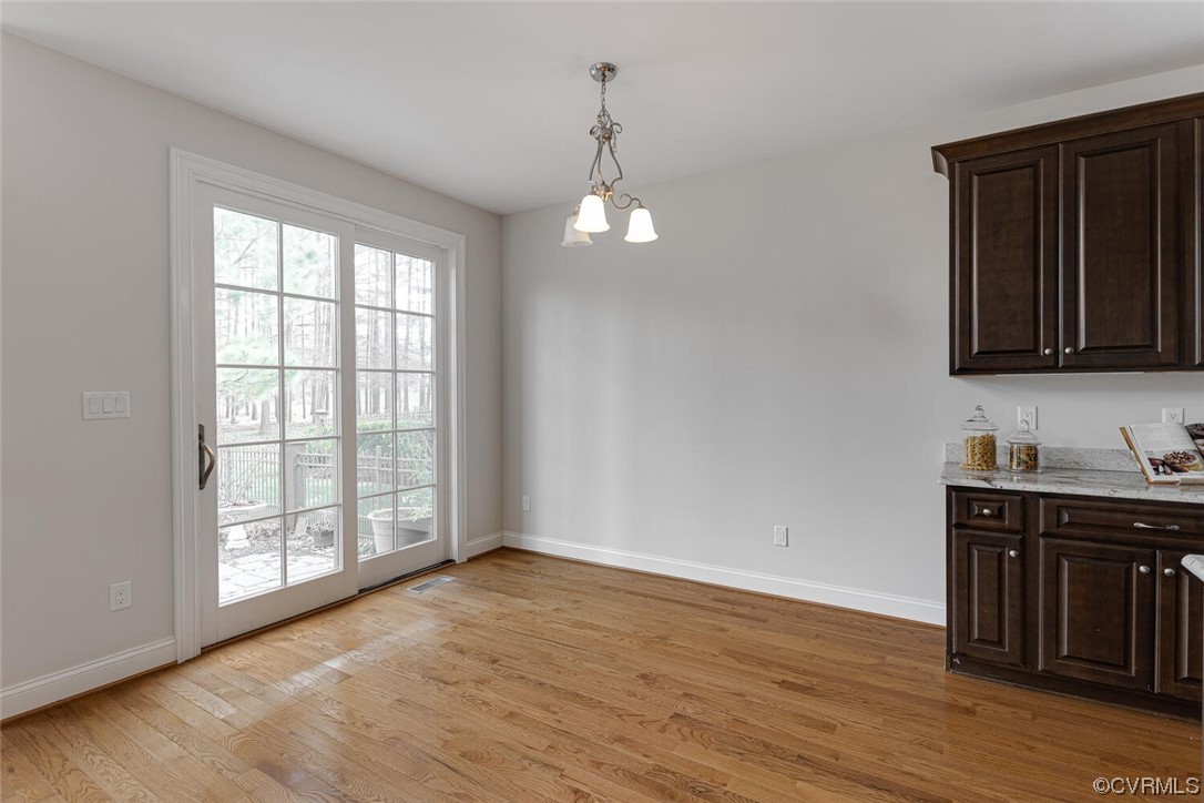488 Bel Bridge Circle Midlothian, VA 23113 - Photo 15 of 38 wooden floor in an empty room with a window