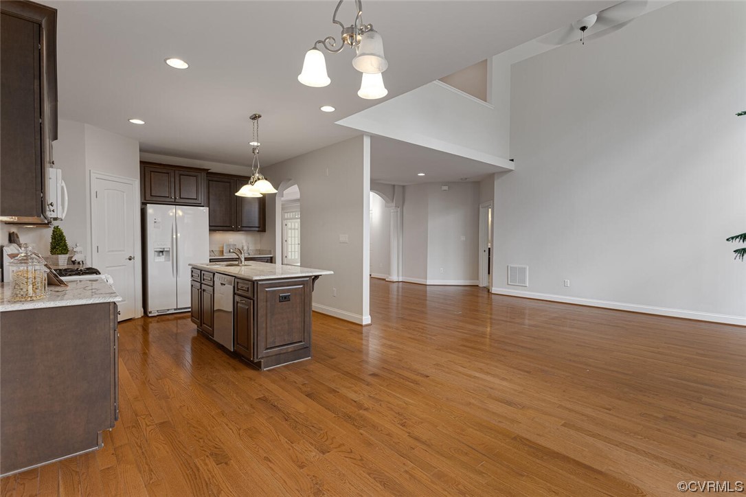 488 Bel Bridge Circle Midlothian, VA 23113 - Photo 17 of 38 a kitchen with a refrigerator and a stove top oven