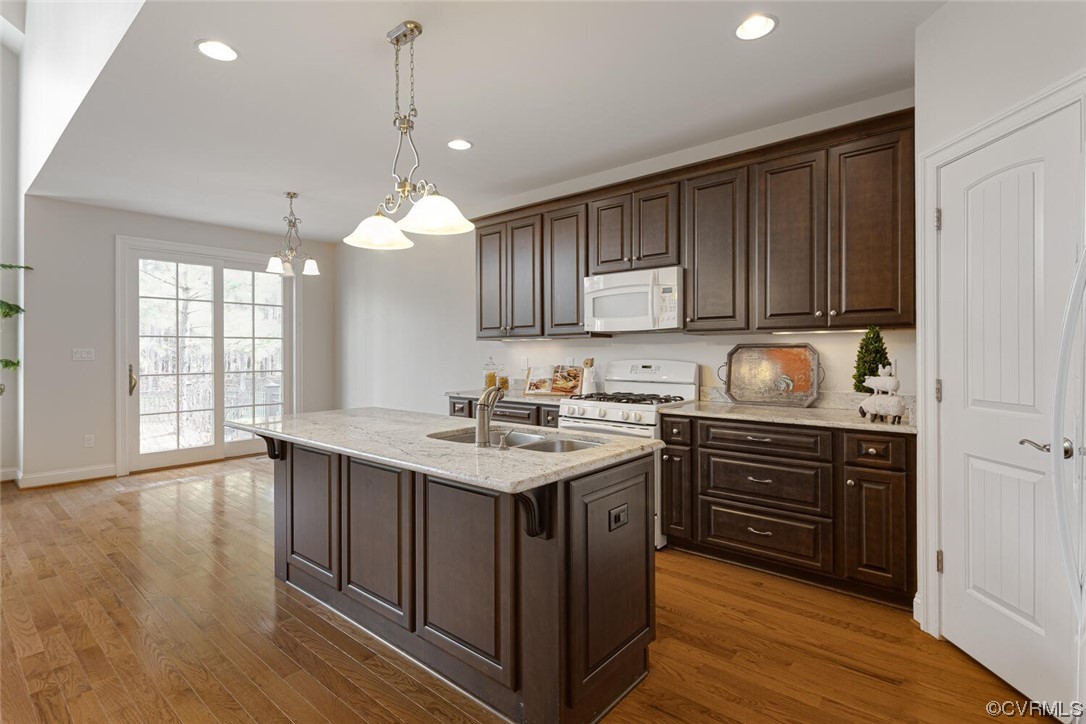 488 Bel Bridge Circle Midlothian, VA 23113 - Photo 18 of 38 a kitchen with a sink and wooden cabinets
