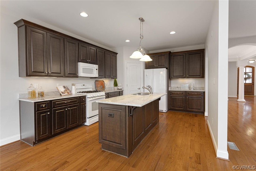 488 Bel Bridge Circle Midlothian, VA 23113 - Photo 19 of 38 a kitchen with a sink stove and cabinets