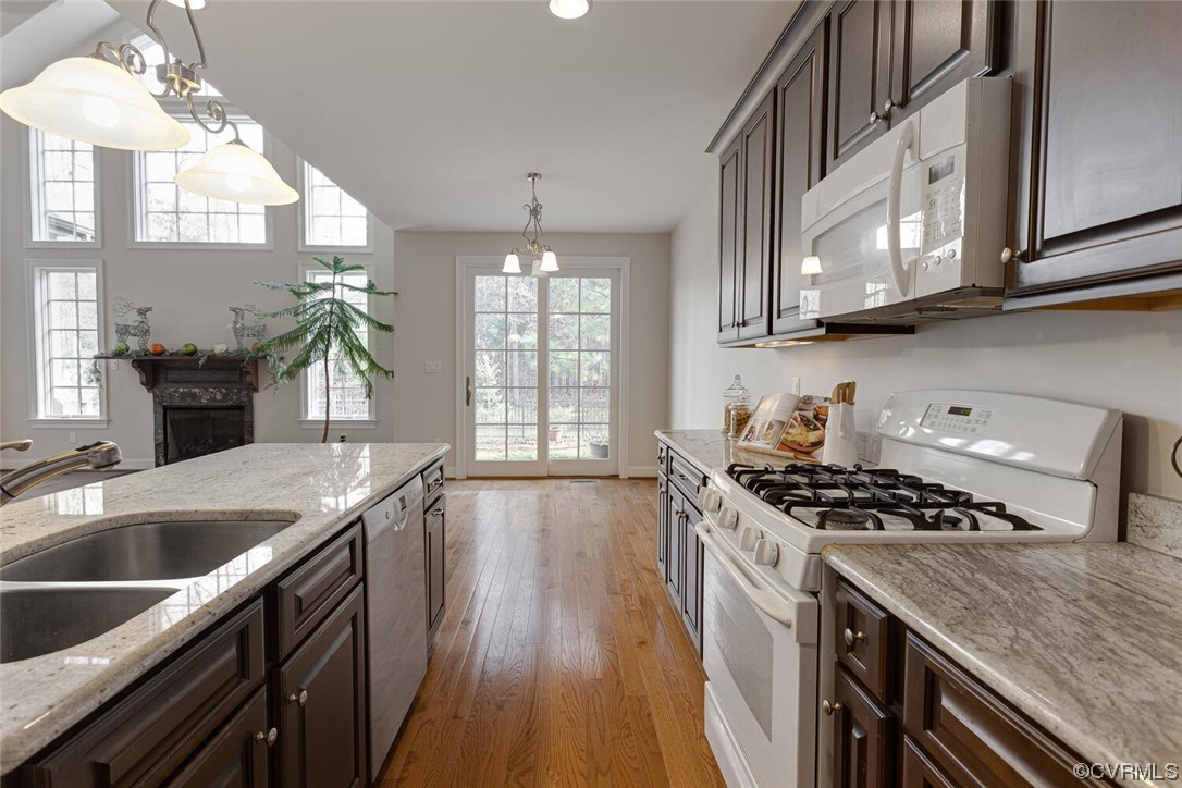 488 Bel Bridge Circle Midlothian, VA 23113 - Photo 20 of 38 a kitchen with granite countertop a sink stove and cabinets