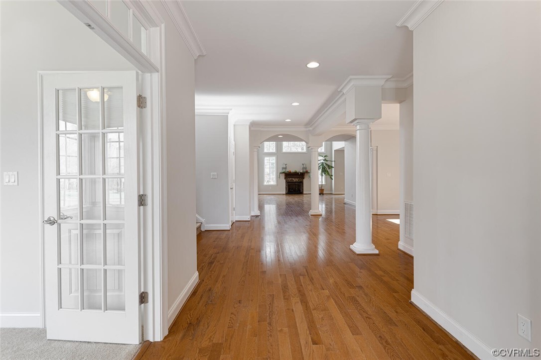 488 Bel Bridge Circle Midlothian, VA 23113 - Photo 6 of 38 view of a hallway with wooden floor a glass door and a bathroom