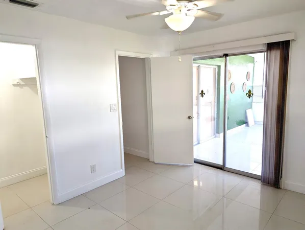 a view of a glass door and a window