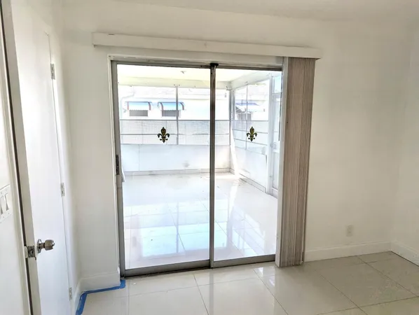 a view of a living room with a glass door