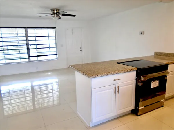 a kitchen that has a sink and a stove