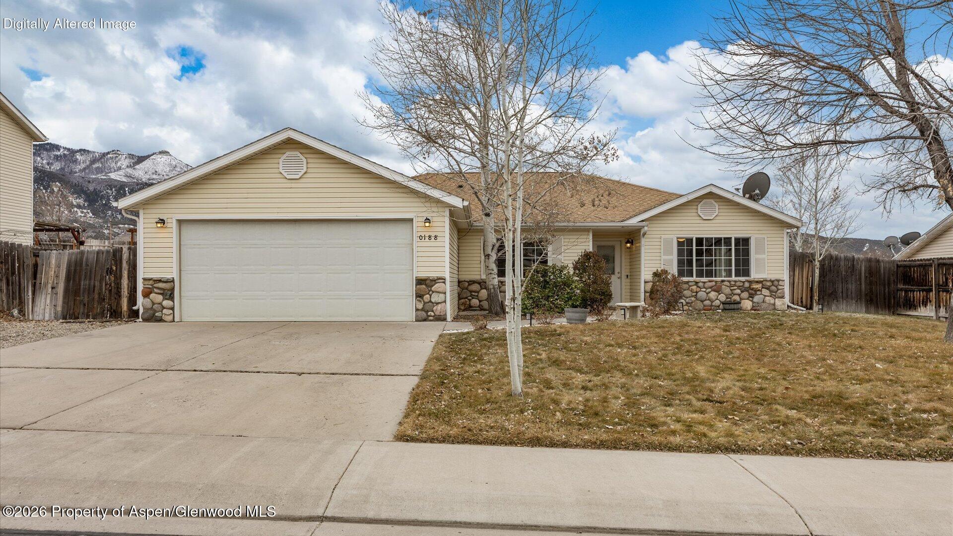 188 Cliff View Circle Parachute, CO 81635 - Photo 1 of 36 a front view of a house with garden