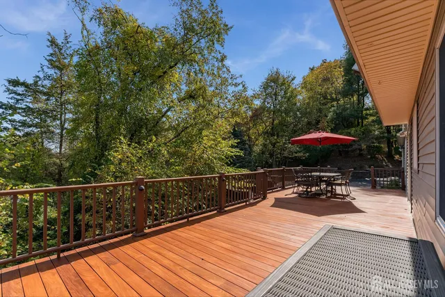 a view of a backyard with sitting area