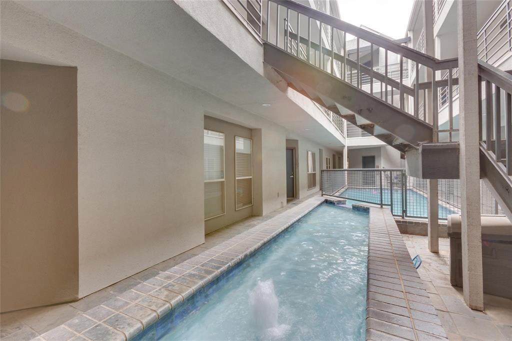 4104 North Hall Street, Unit 102 Dallas, TX 75219 - Photo 5 of 18 Courtyard area featuring a long water feature with tile surround
