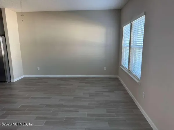 a view of an empty room and window