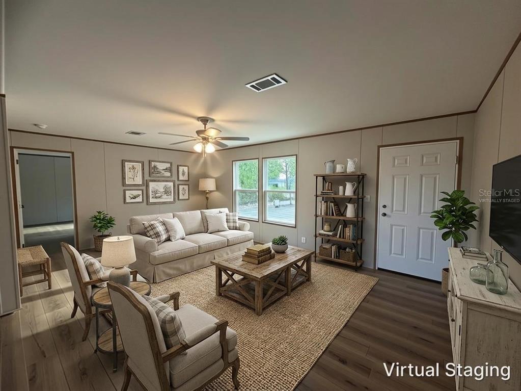114 Nutmeg Trail Interlachen, FL 32148 - Photo 6 of 33 a living room with furniture and a large window