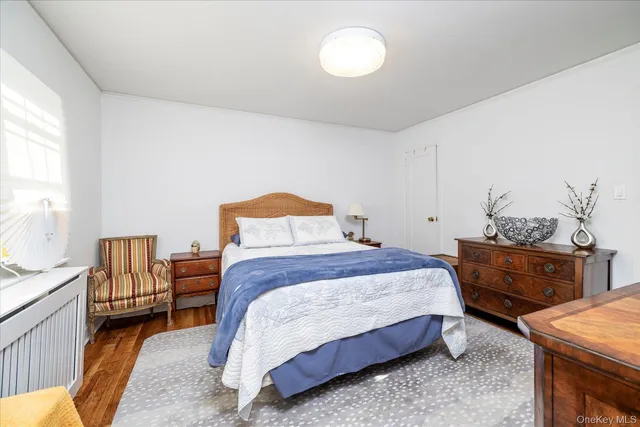 a bedroom with a bed and dresser