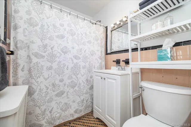 a bathroom with a toilet and a sink